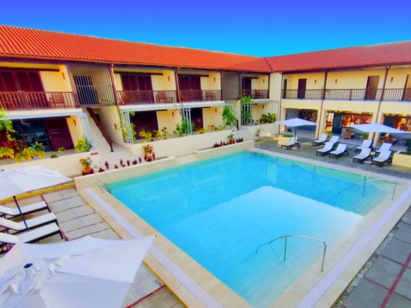 Mystique Trinidad by Royalton — patio pool and colonial roofs